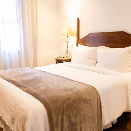 罗萨里奥太阳酒店 欧鲁普雷图 外观 照片 A bed